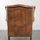Comfortable cowhide wingback armchair with a timeless English look