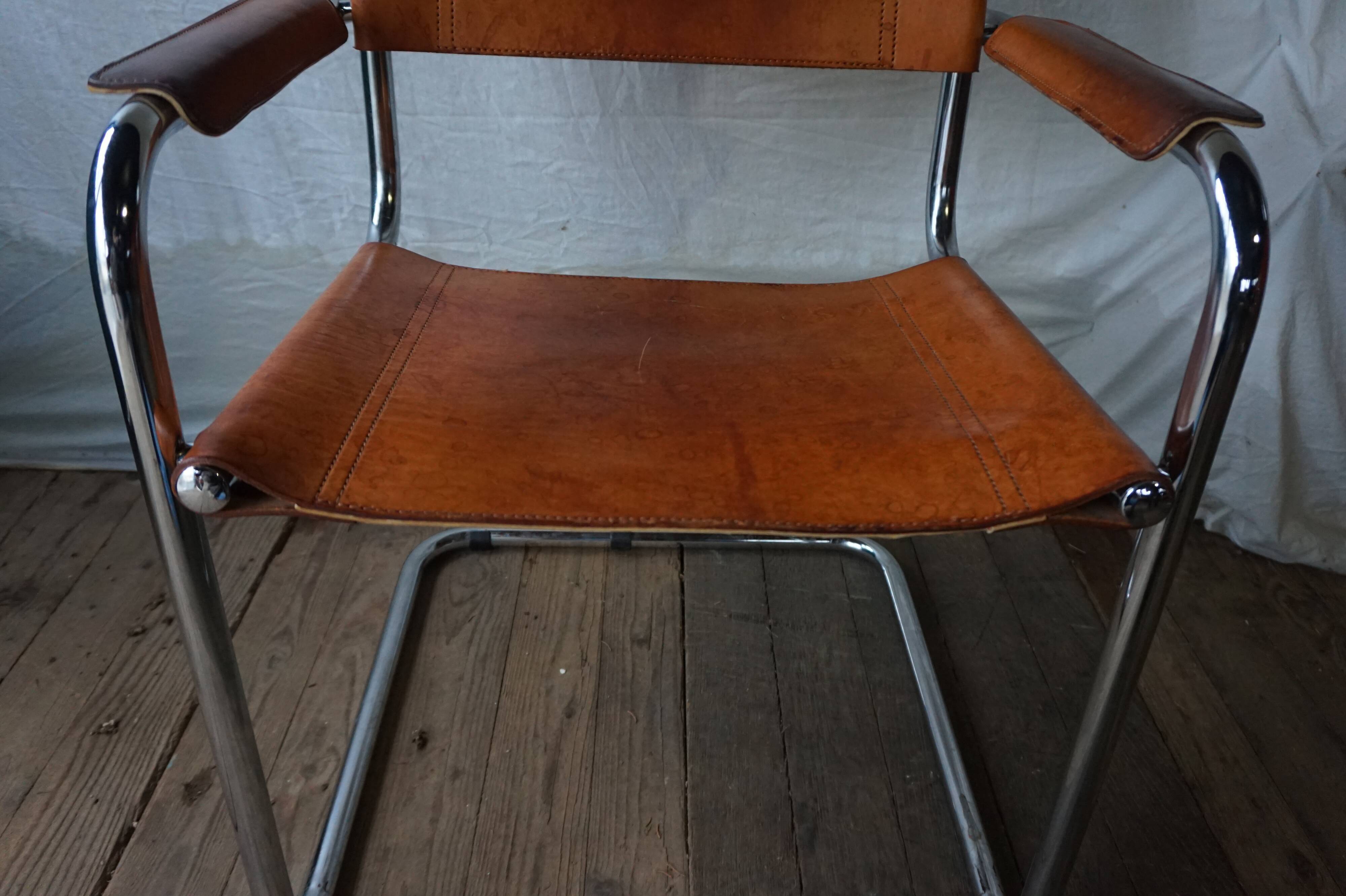 Three  leather armchairs