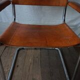 Three  leather armchairs