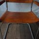 Trois fauteuils en cuir