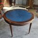 Elegant game table or circular extending side table in Louis XVI style.