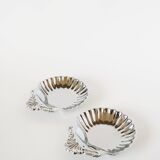 Pair of worked stainless steel shell trinket trays, 1970