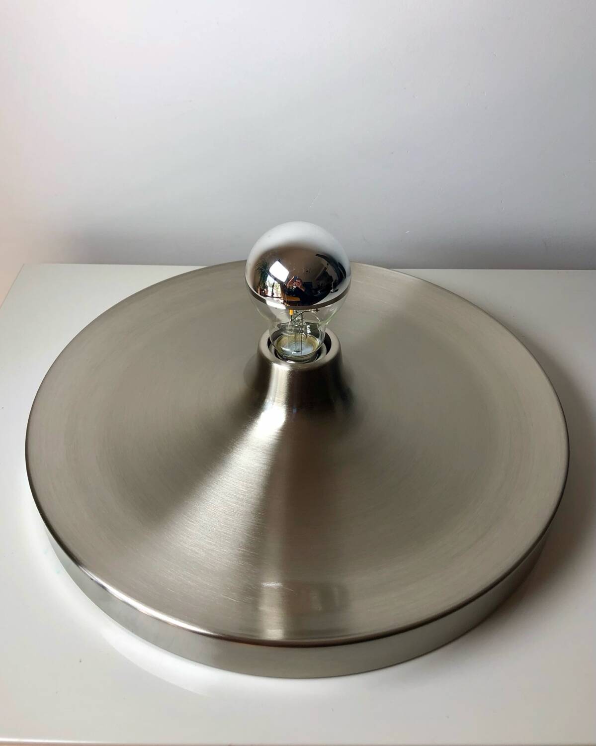 Modernist disc wall sconce