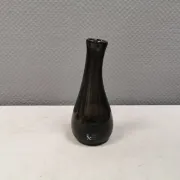 A unique vase in hand-blown glass with a hint of purple in the colour.