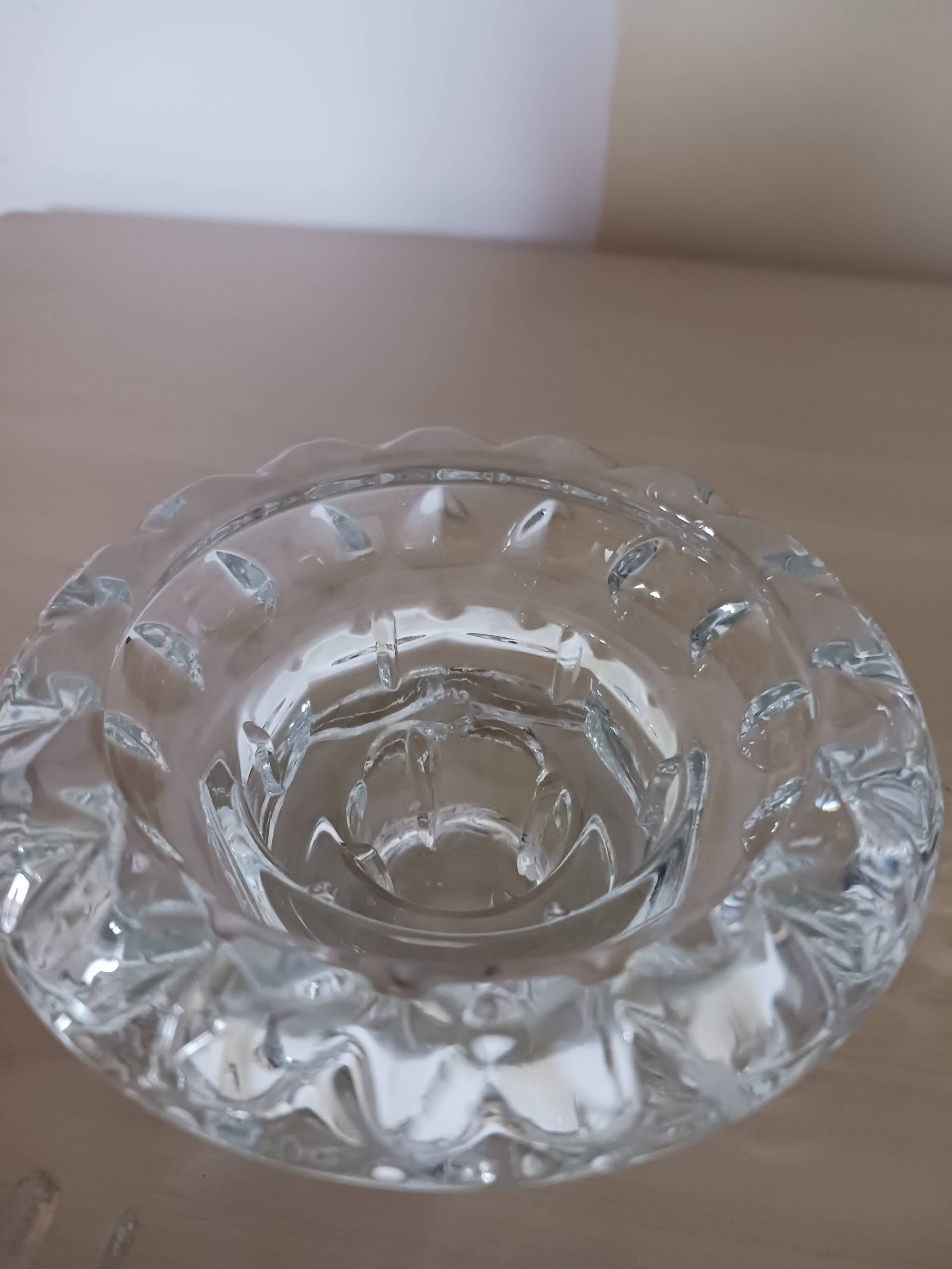 Moulded glass candle holders.