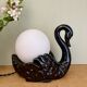 Vintage lamp, black ceramic swan and white opaline globe