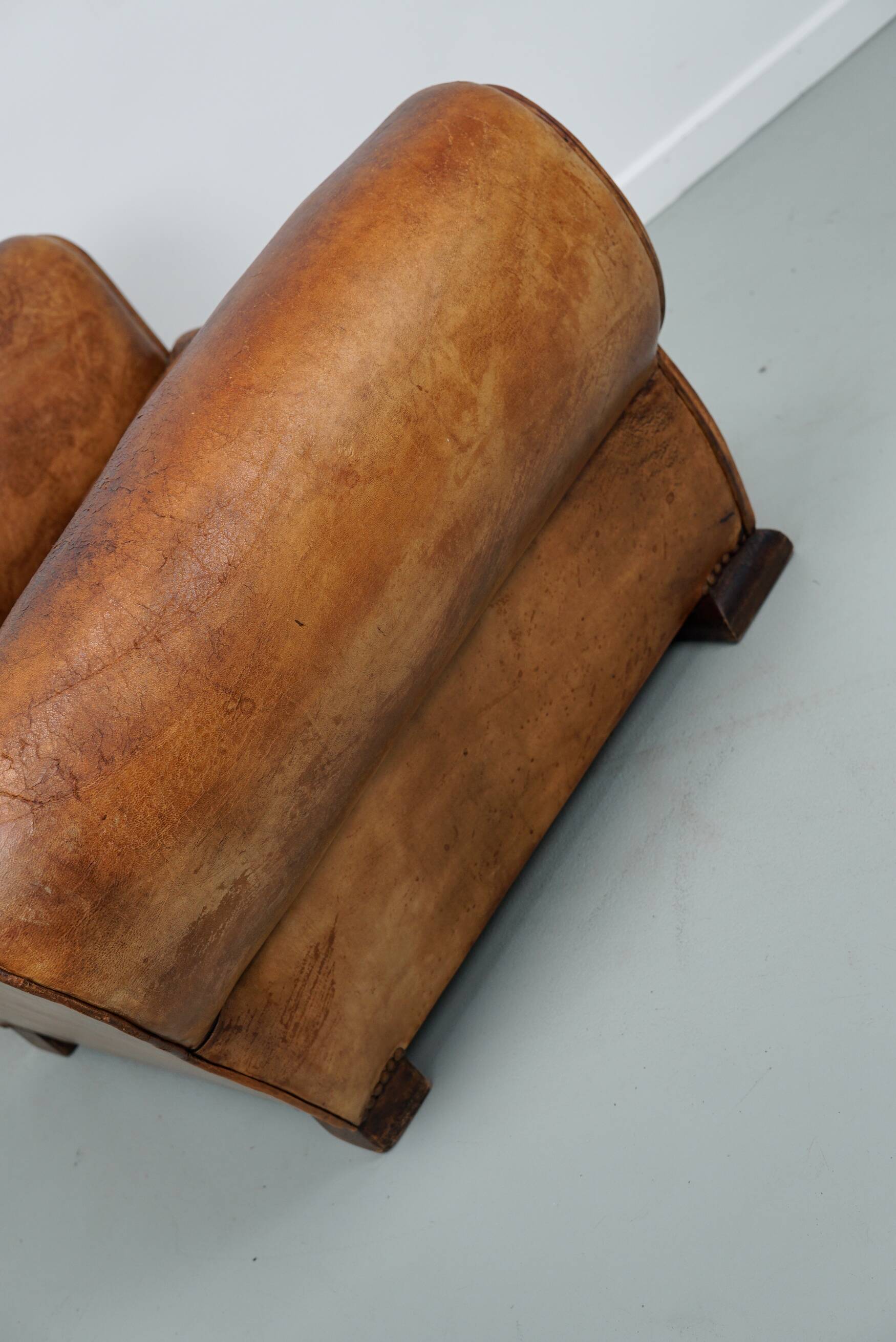 French moustache back cognac-colored leather club chair, 1940s