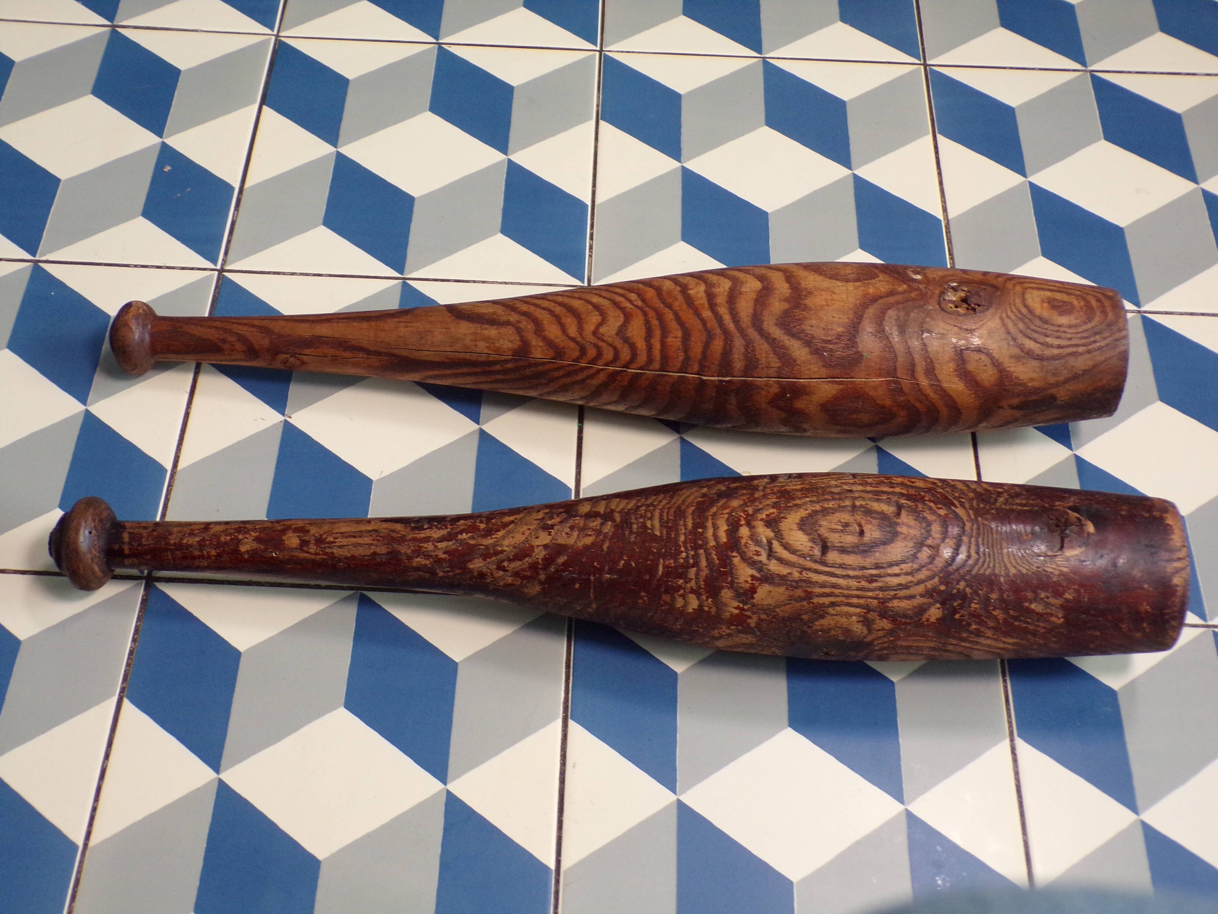 2 old wooden juggling clubs