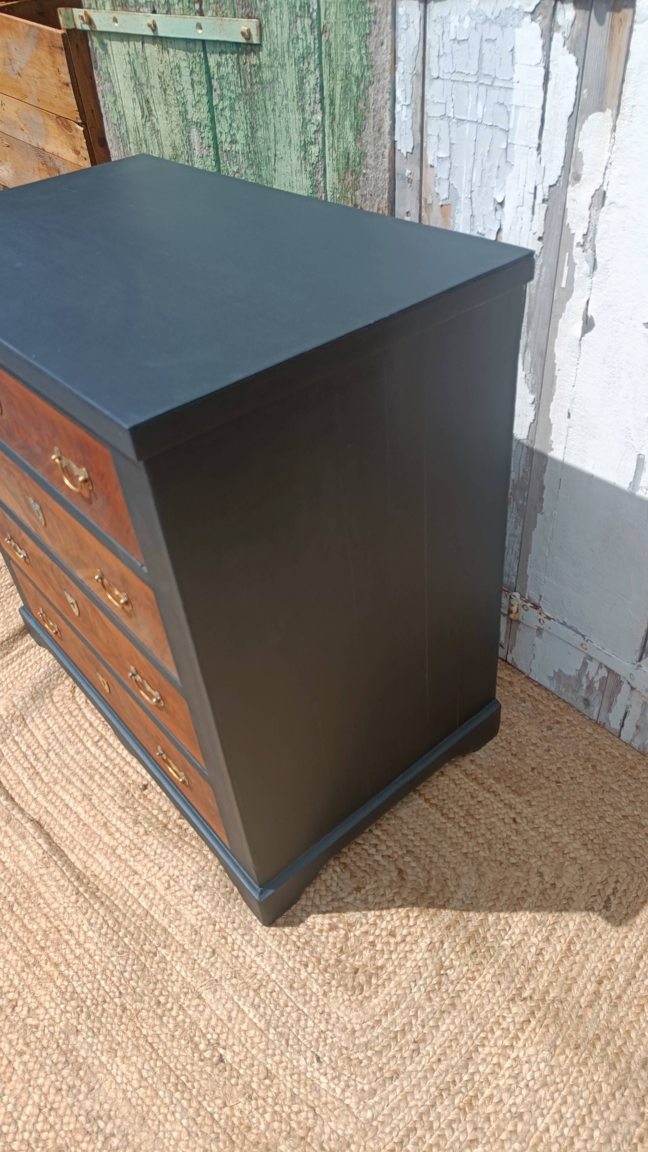 Vintage commode revamped in matte black & wood with warm tones.