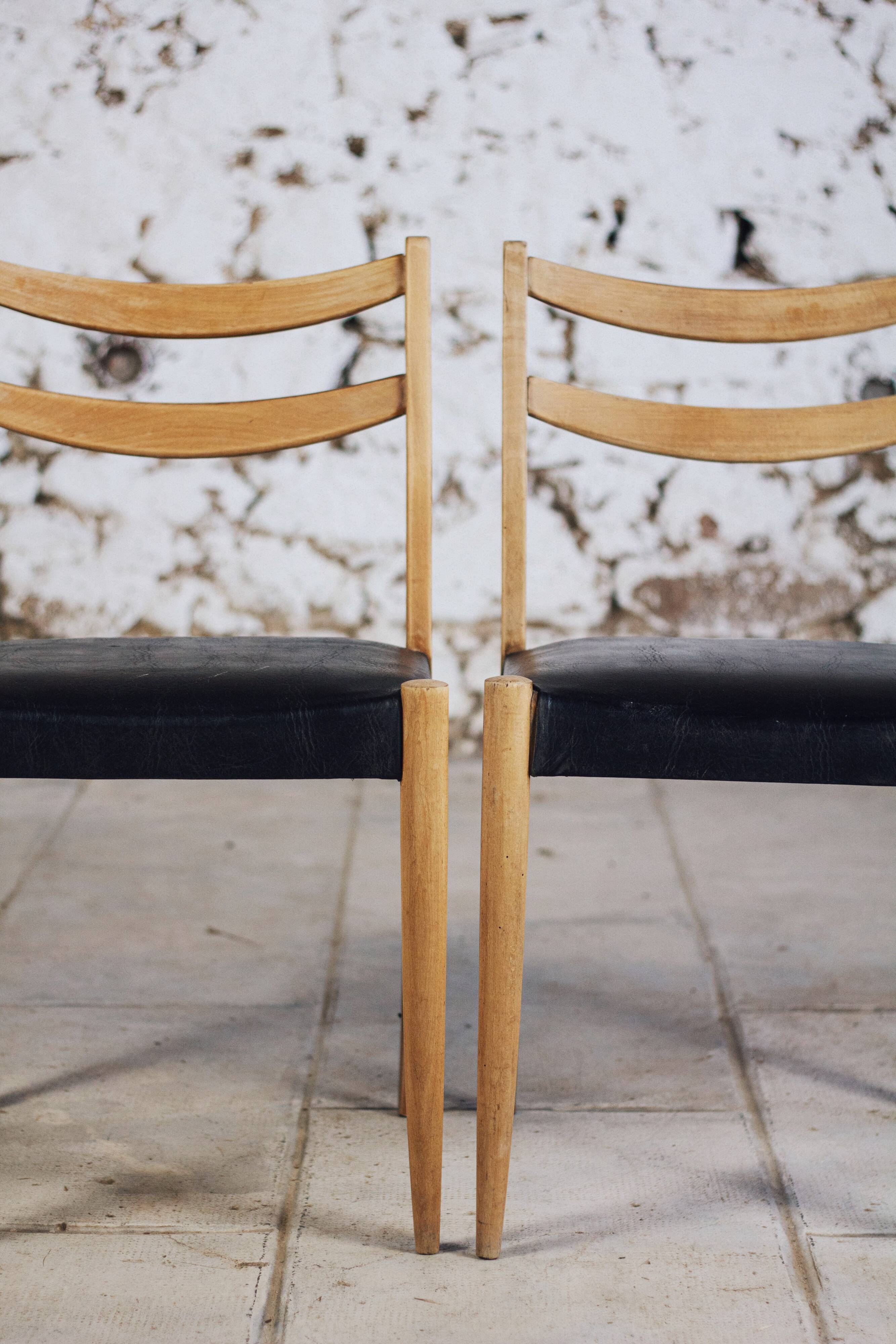 Pair of Scandinavian chairs in teak and faux leather, 1960.