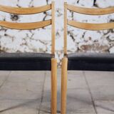 Pair of Scandinavian chairs in teak and faux leather, 1960.