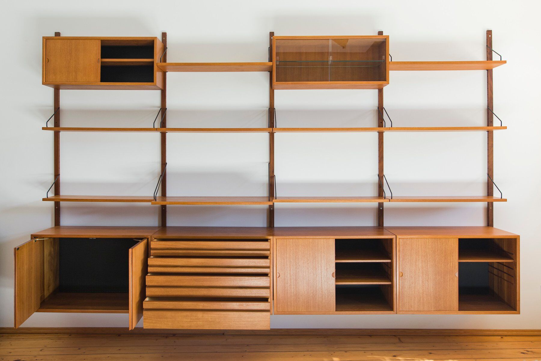 Modular wall shelving system by Poul Cadovius for Cado, 1960s