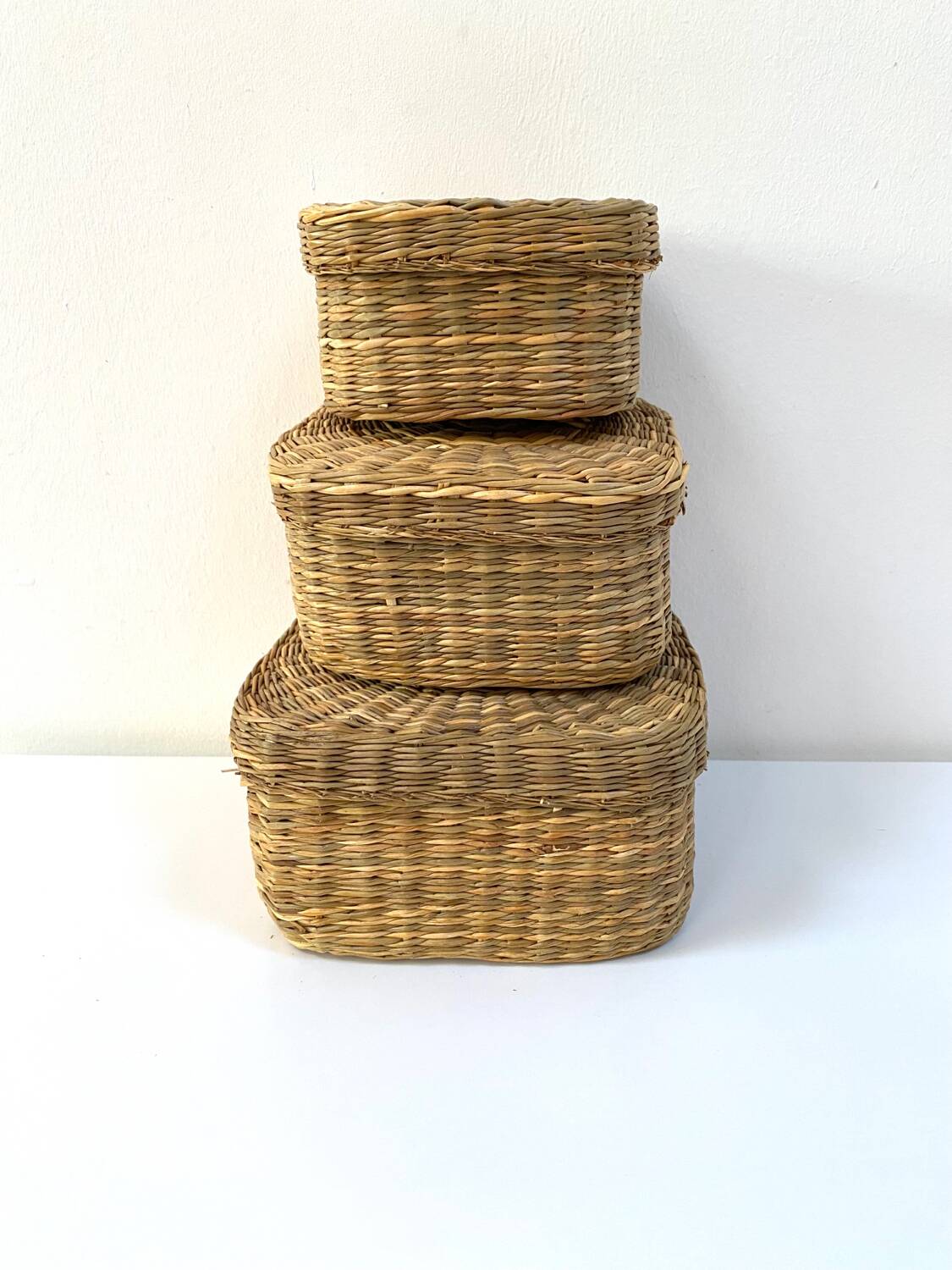 Vintage trio of small rattan nesting baskets