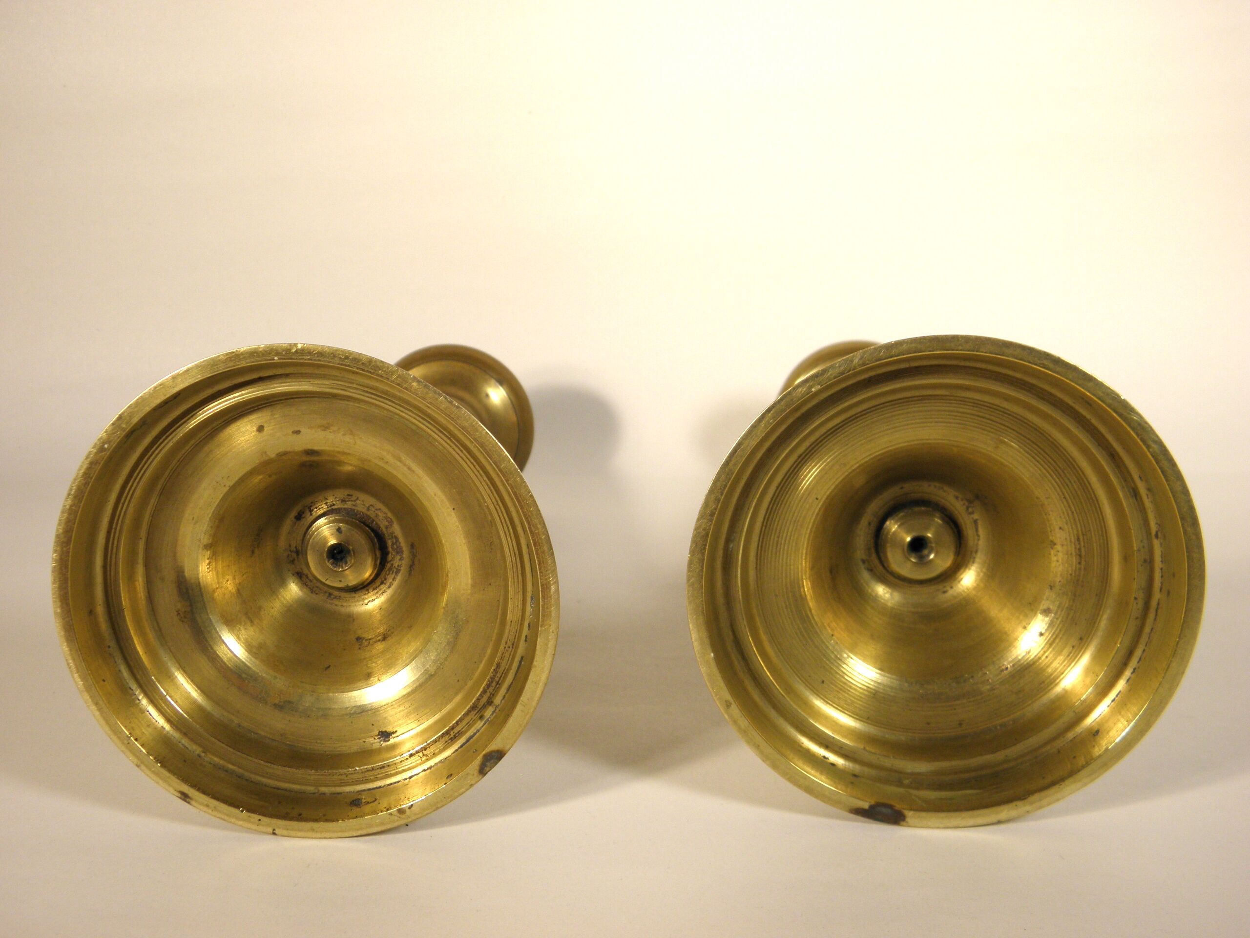 Pair of brass push candlesticks