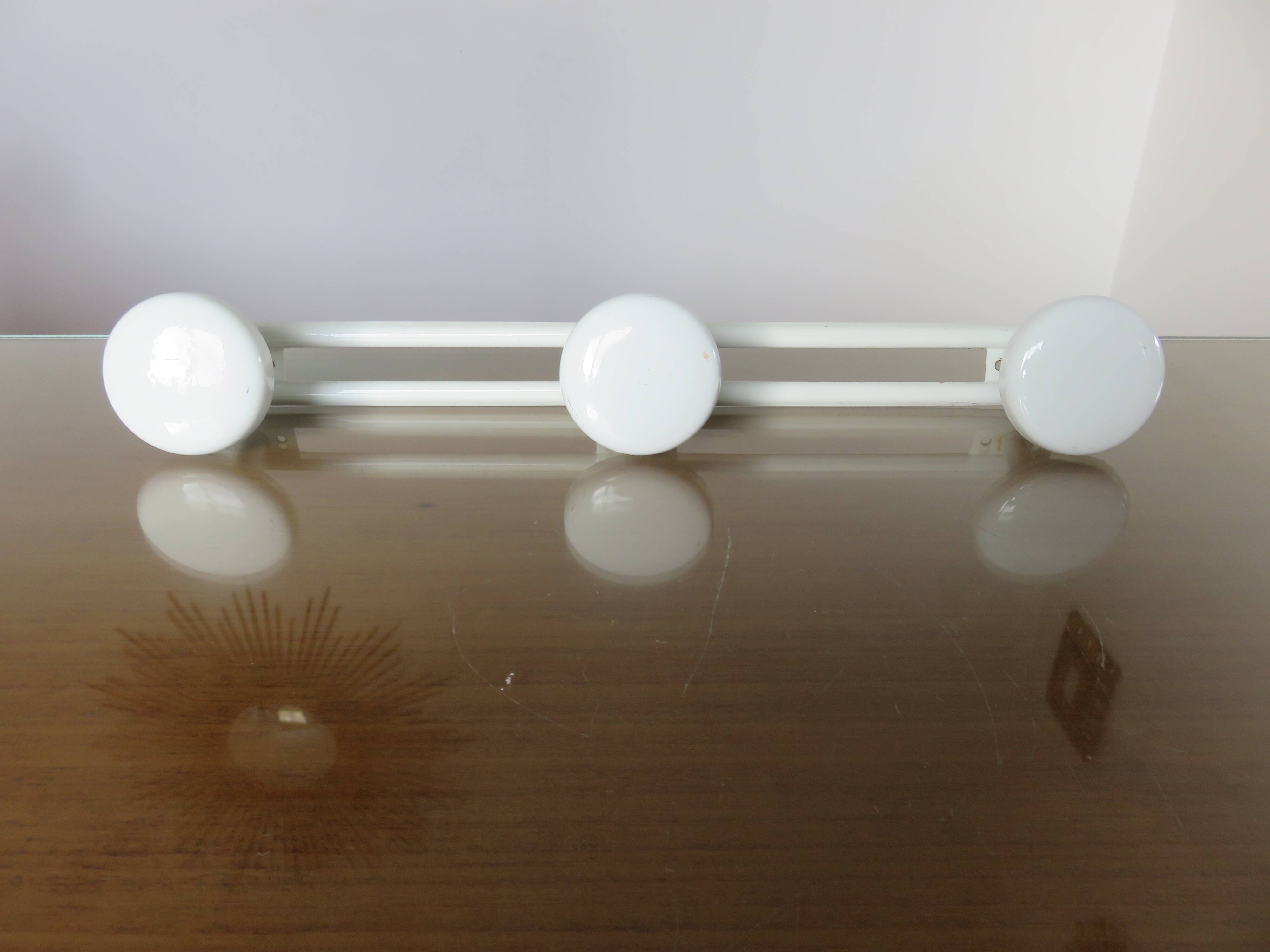 White lacquered metal wall coat rack with 3 hooks, 1970.