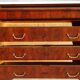 Antique mahogany chest of drawers with white marble.