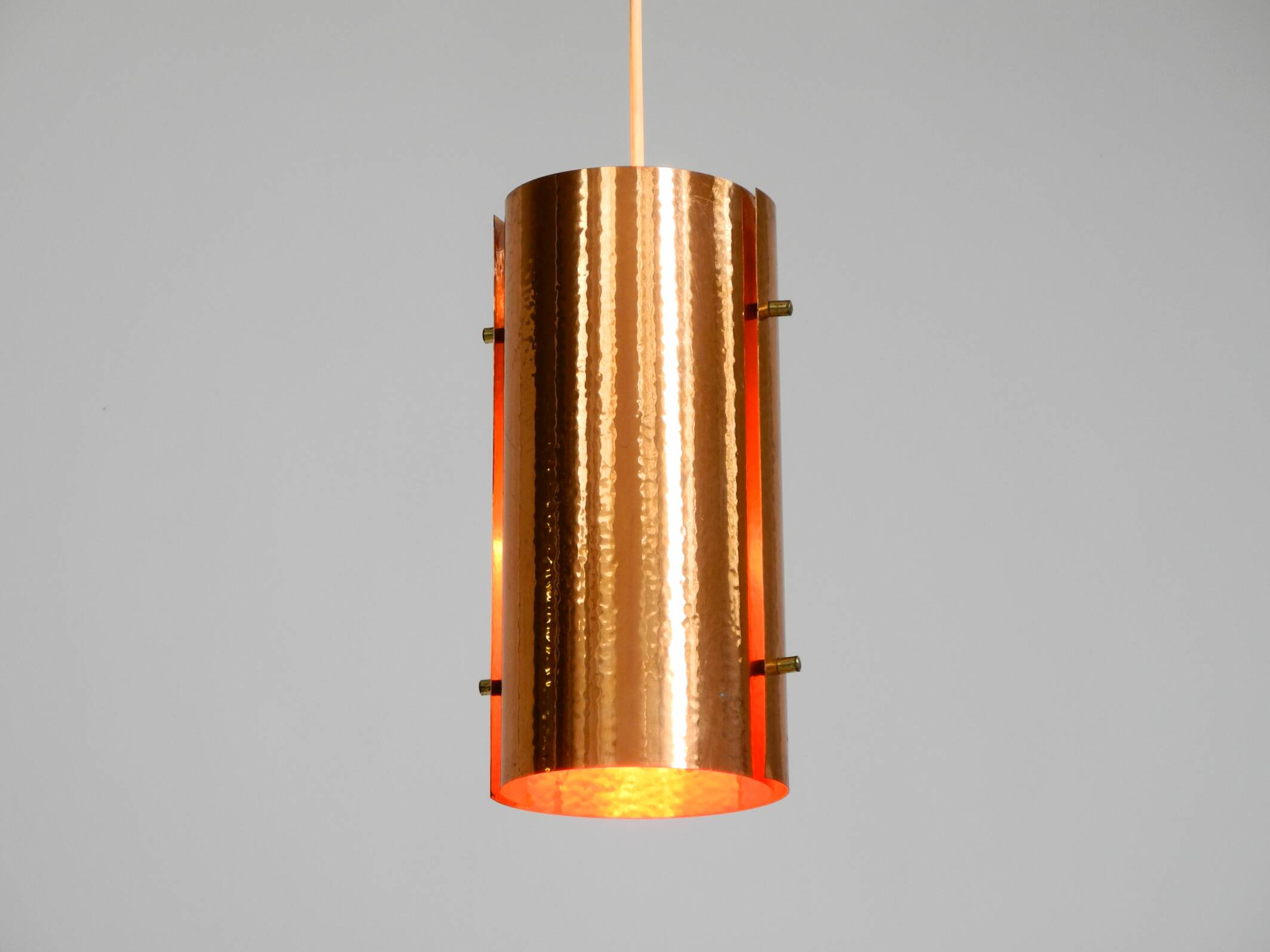 Two 50s tube pendant lamps consisting of two screwed-together copper bowls