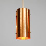 Two 50s tube pendant lamps consisting of two screwed-together copper bowls