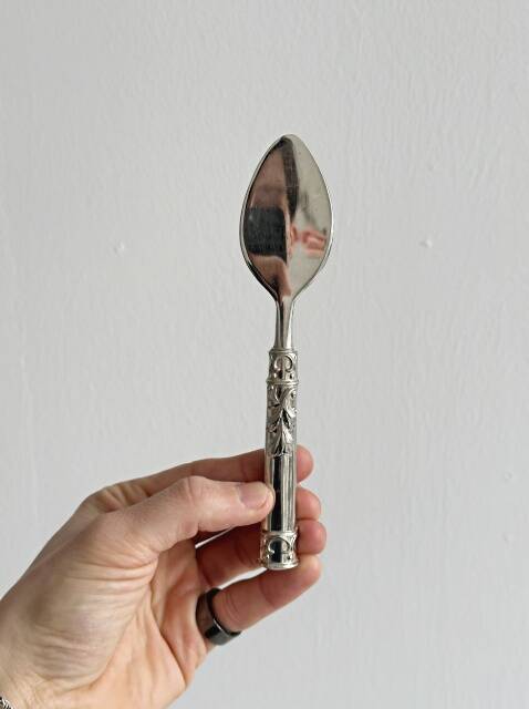 Antique shiny metal cheese cutlery