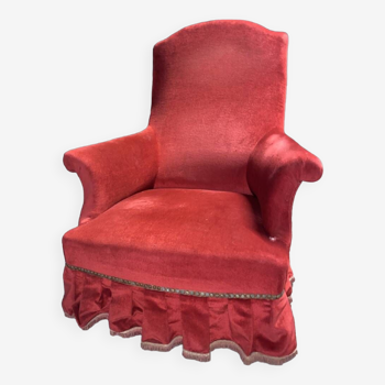 Fauteuil rouge vif a frange