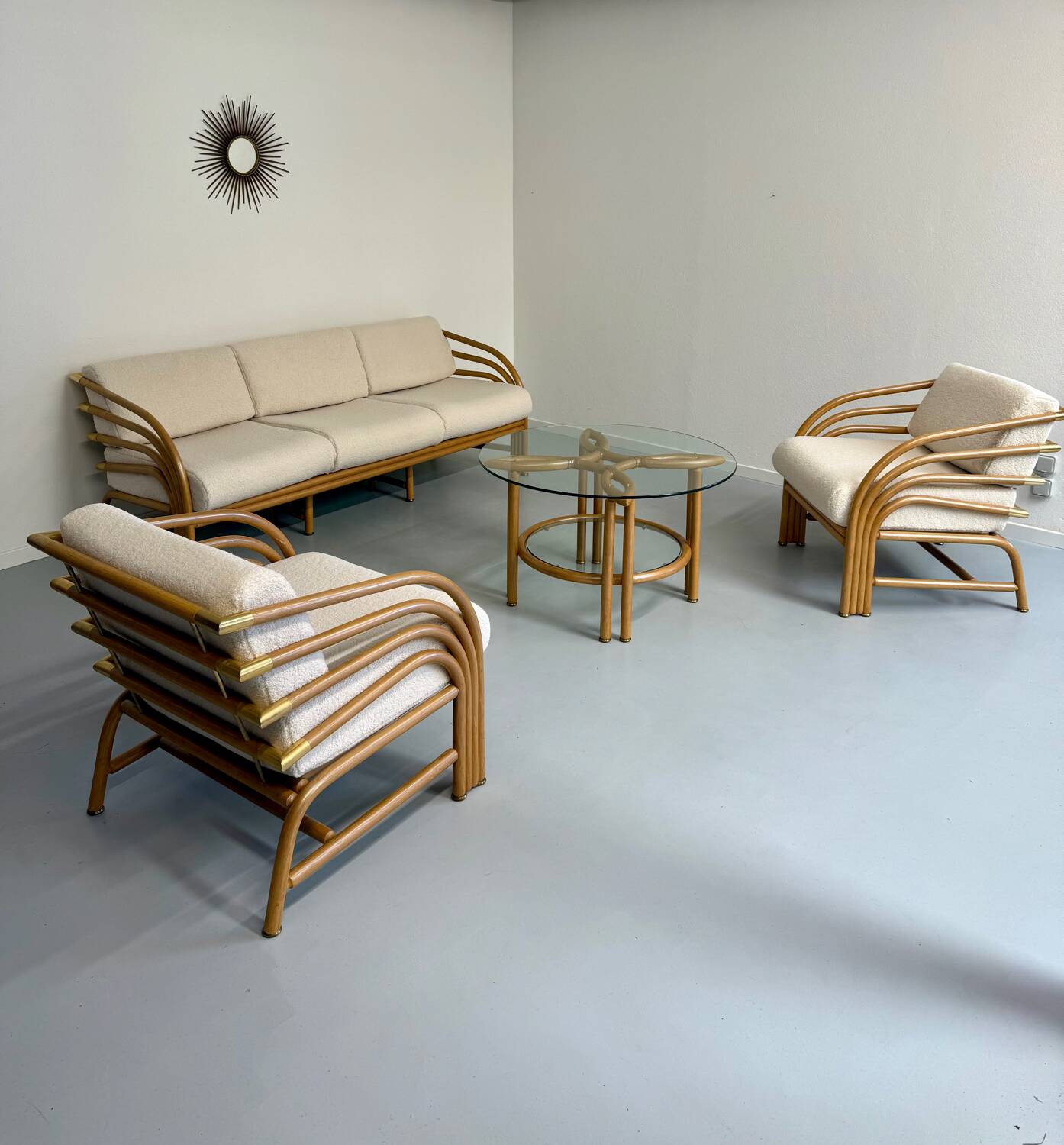 Complete living room with rattan sofa and white bouclette, brass finish, 80's design