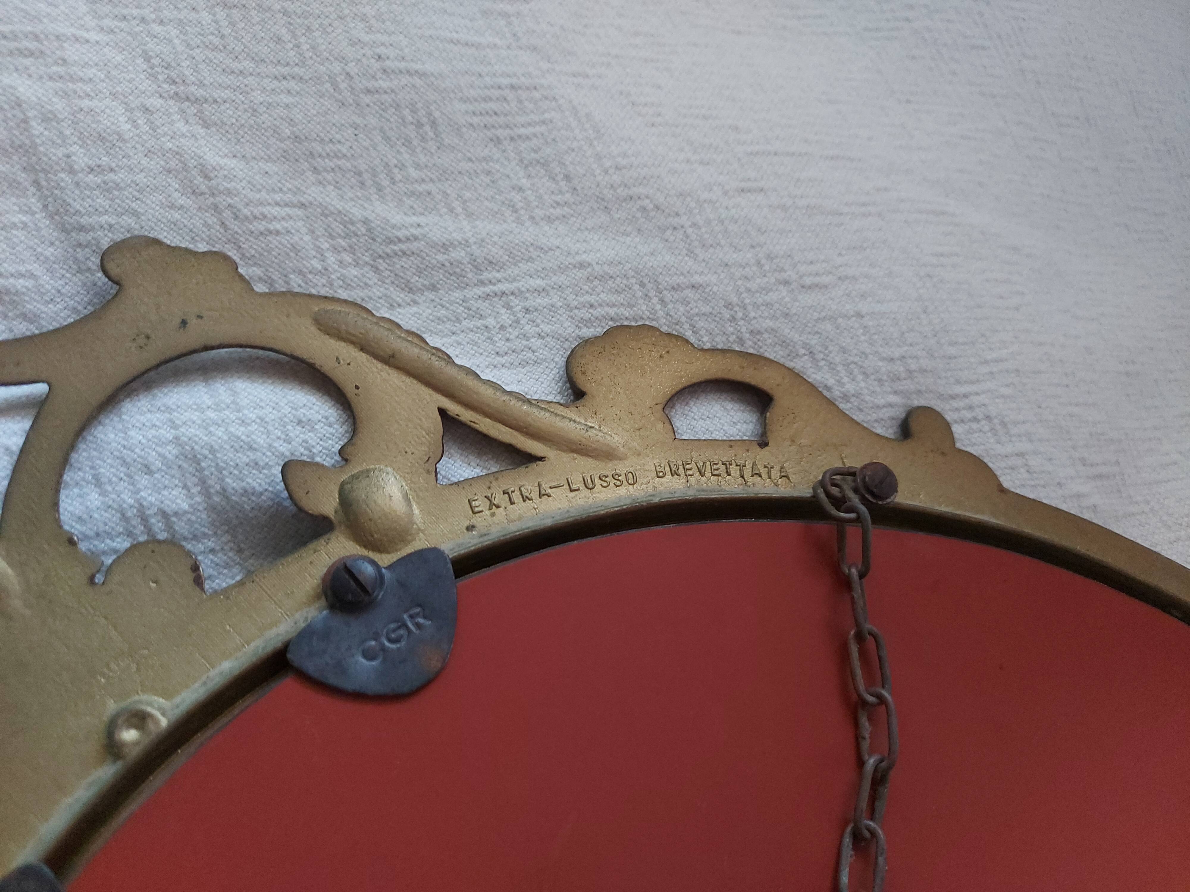 Baroque mirror in gilded brass, C.G.R