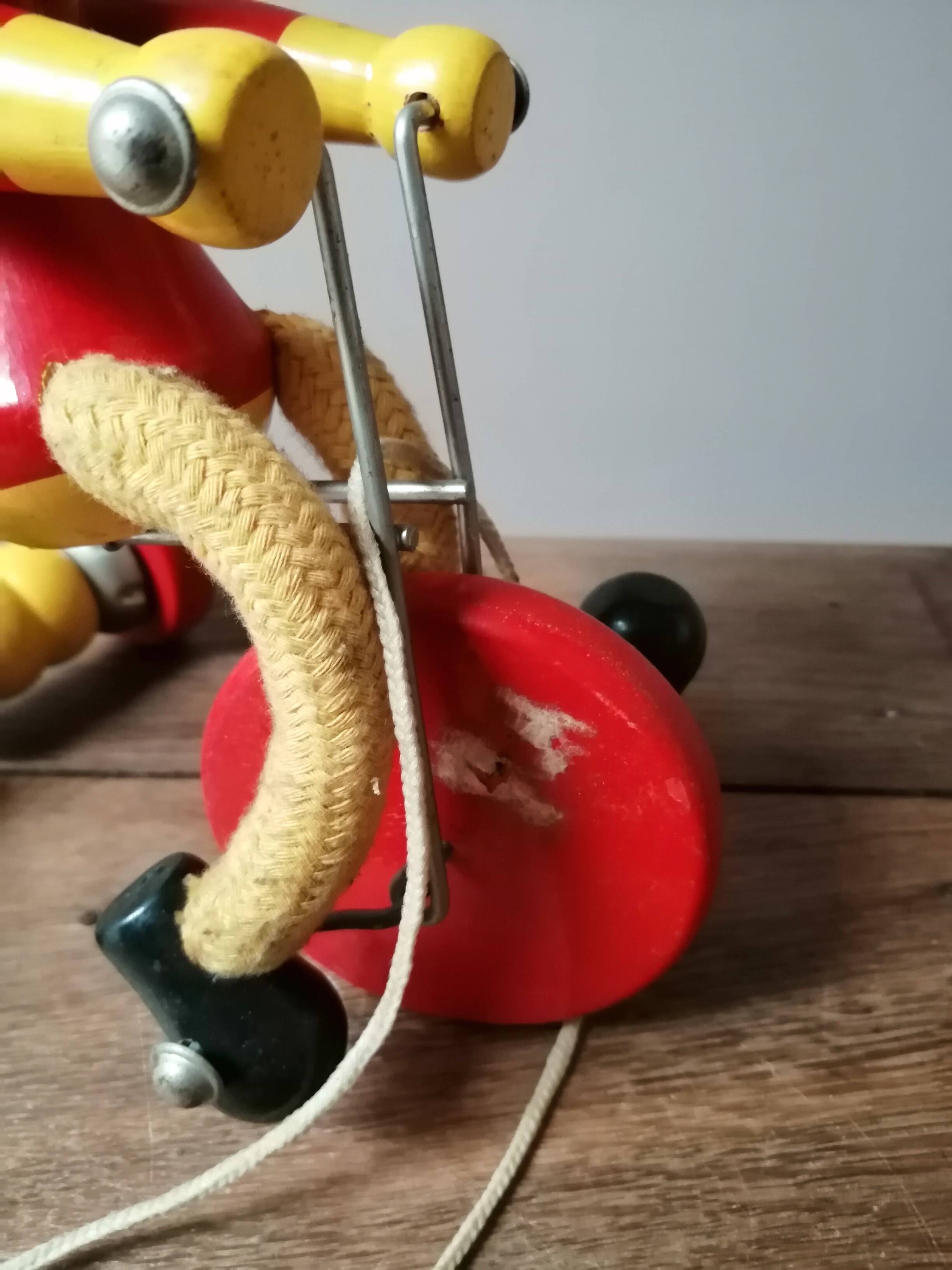 Old Mickey Mouse toy on his wooden tricycle