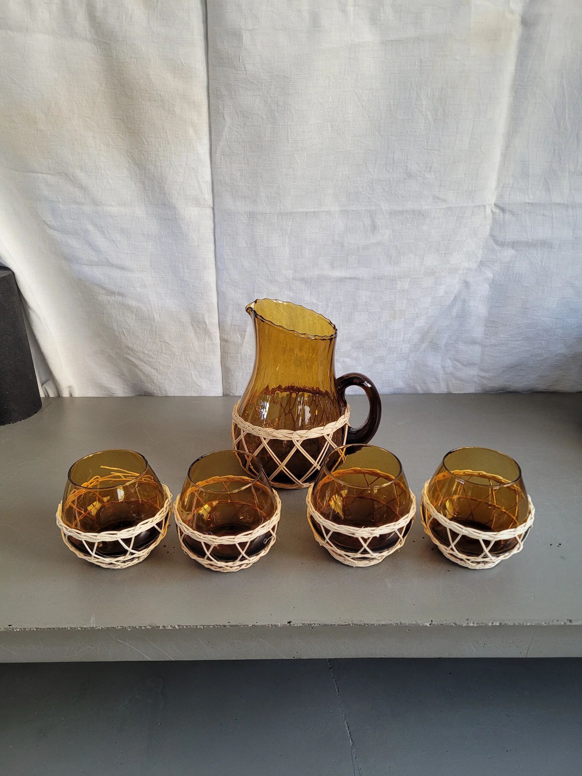 Amber glass and wicker lemonade service