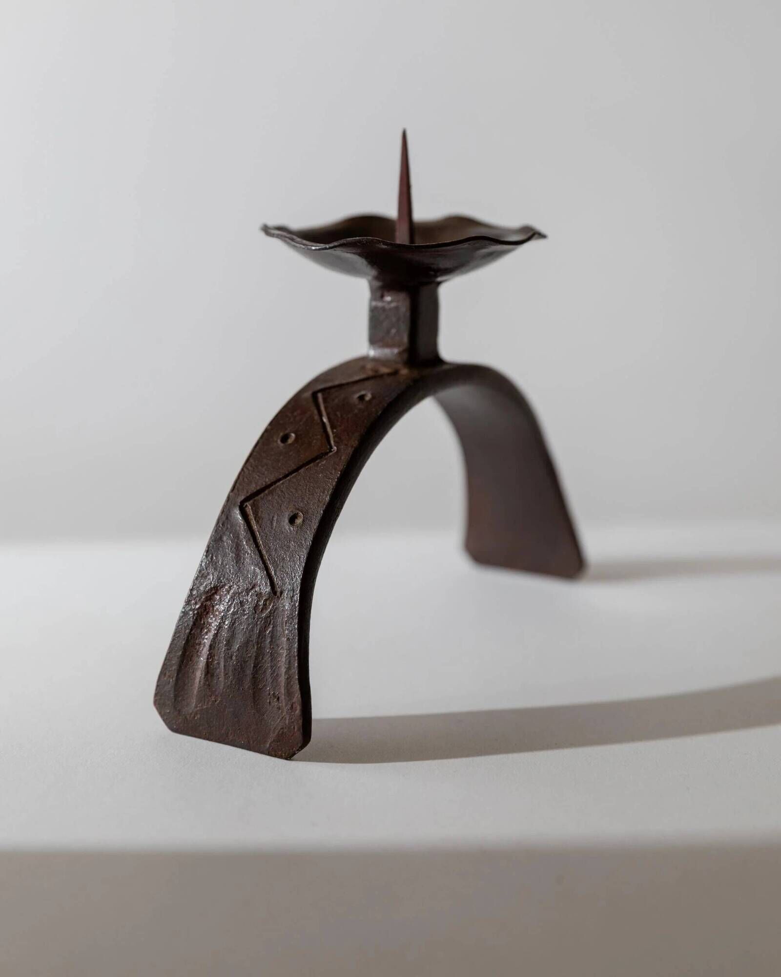 Vintage wrought iron candlestick from the 1960s, sculptural relief pattern for pillar candle, rustic Mid-Century metal, elegant gift idea.