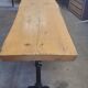 Large bistro table with a wooden top and cast iron legs - 2m56