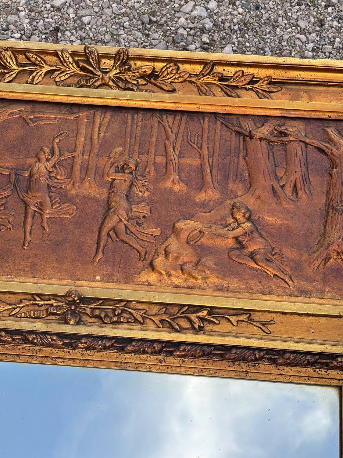 Golden trumeau mirror in Louis XVI style, 20th century.