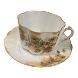 Enameled porcelain cup with saucer