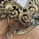 Pair of Napoleon III wall sconces, bevelled mirrors, mask heads.