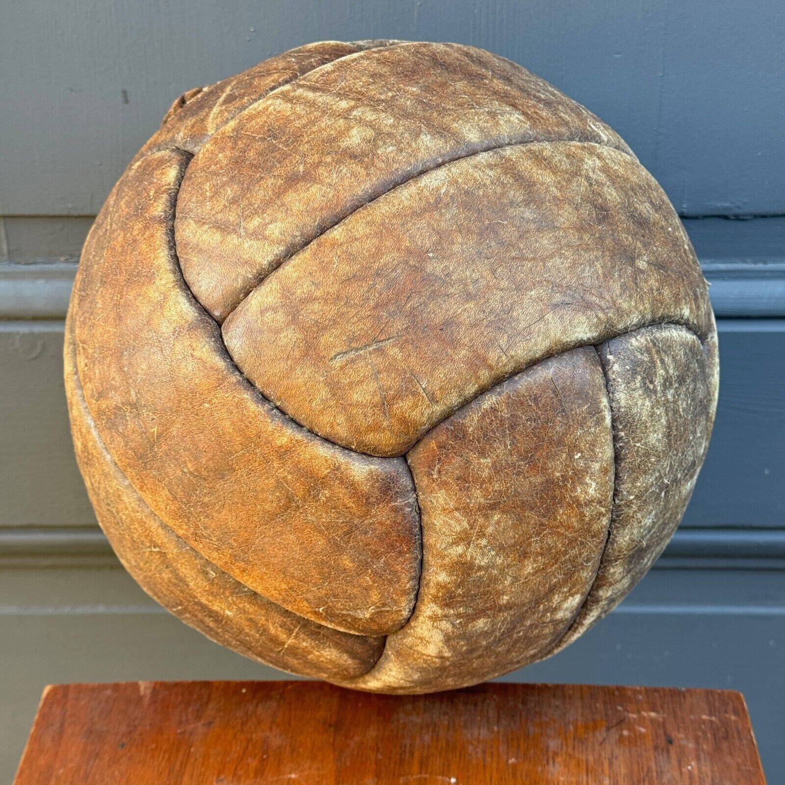 Mid-20th century leather soccer ball with visible stitching and beautiful patina