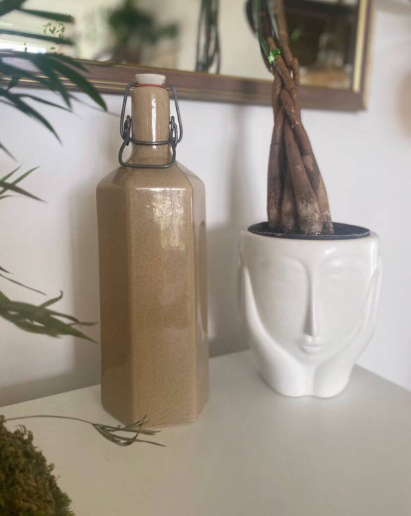 Old enameled stoneware bottle