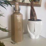 Old enameled stoneware bottle