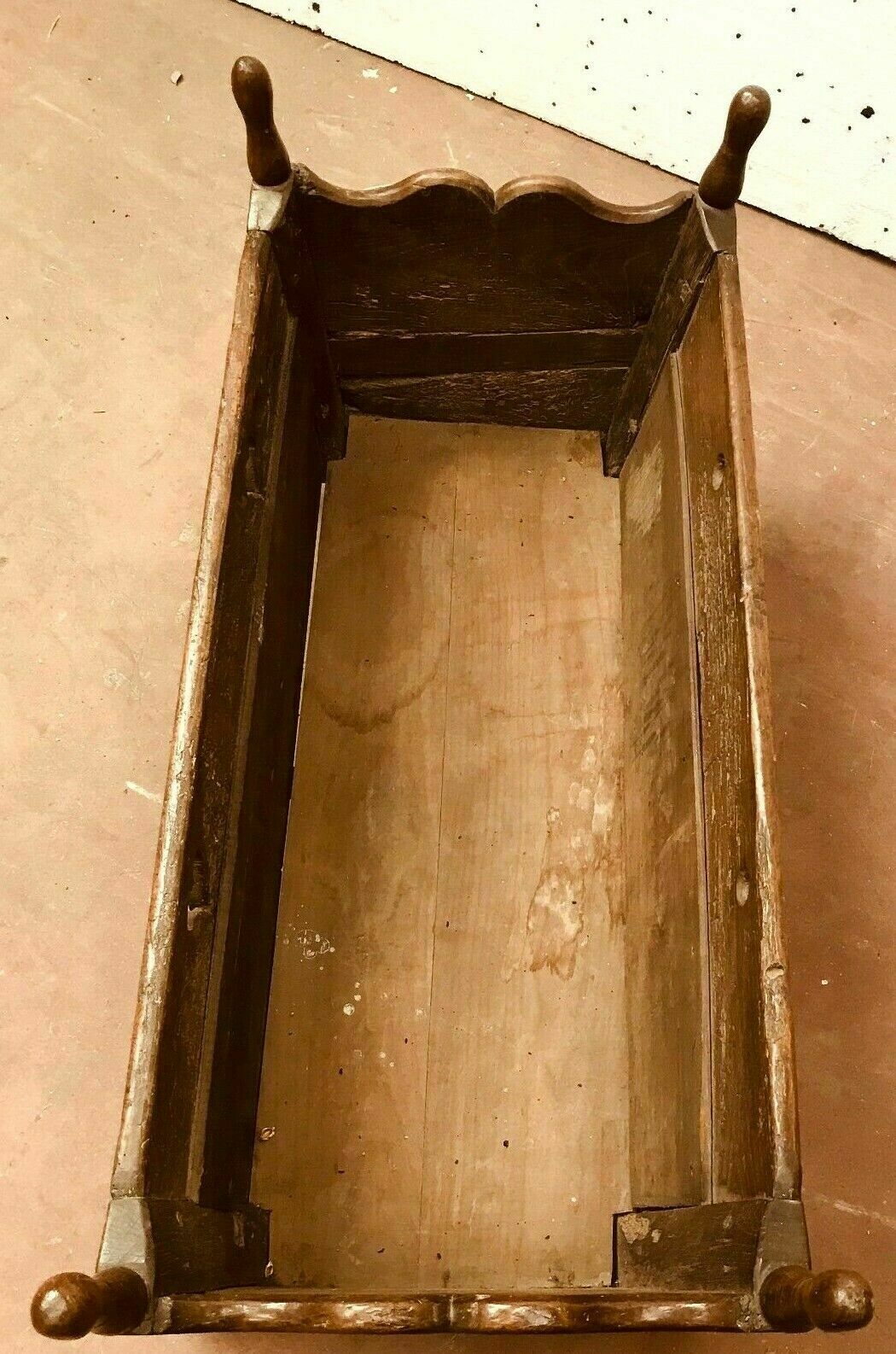 Sculpted walnut rocking cradle