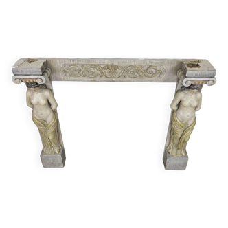 Neoclassical plaster fireplace with caryatids (nude women)