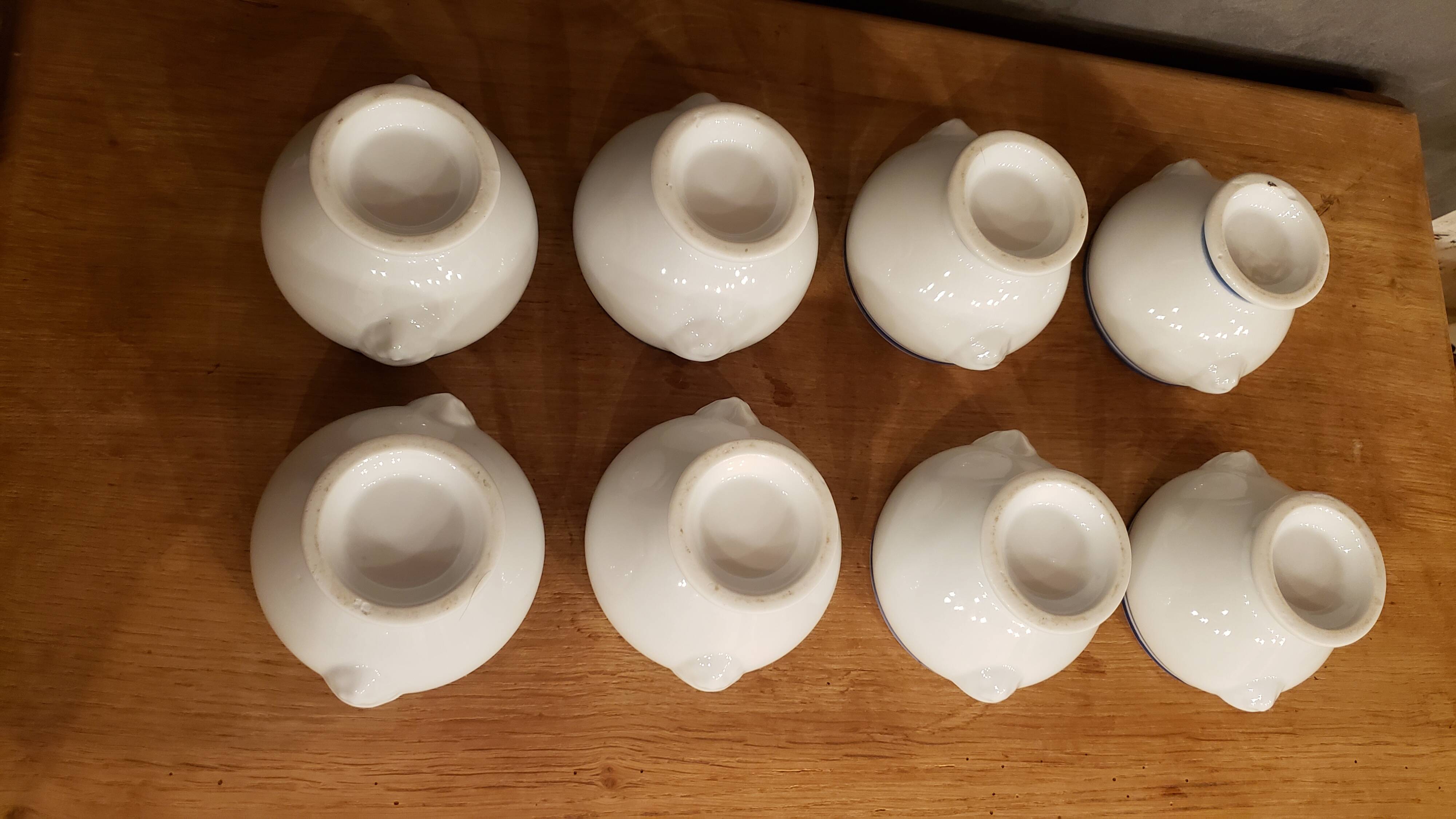 8 white lion head soup bowls with blue edging