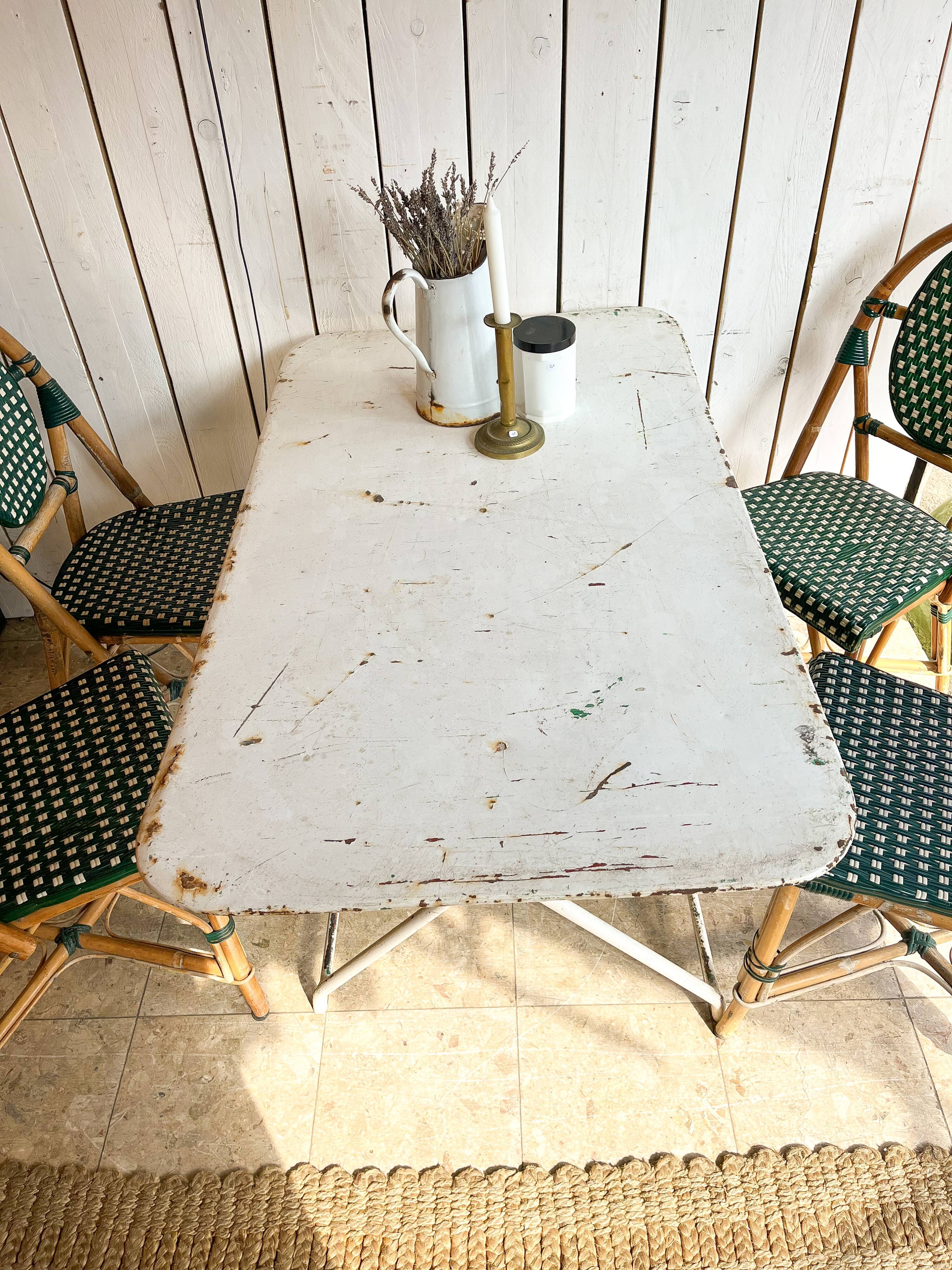 White folding metal bistro table