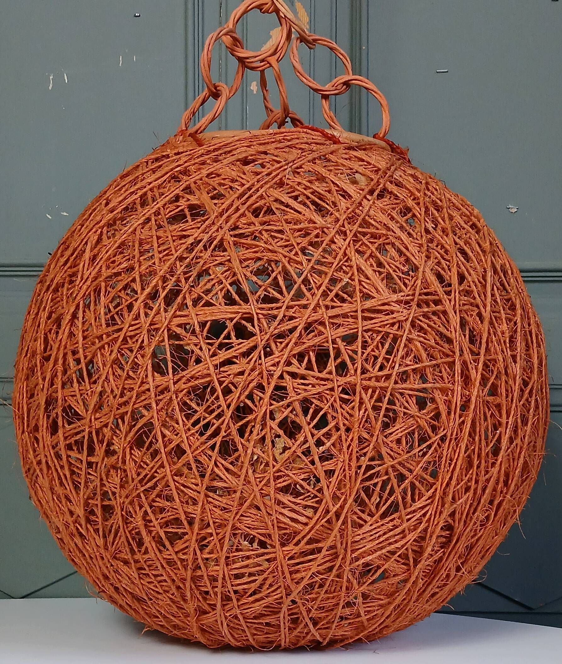 Orange lampshade in cord and rattan from the 1970s