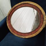 Golden oval art deco mirror