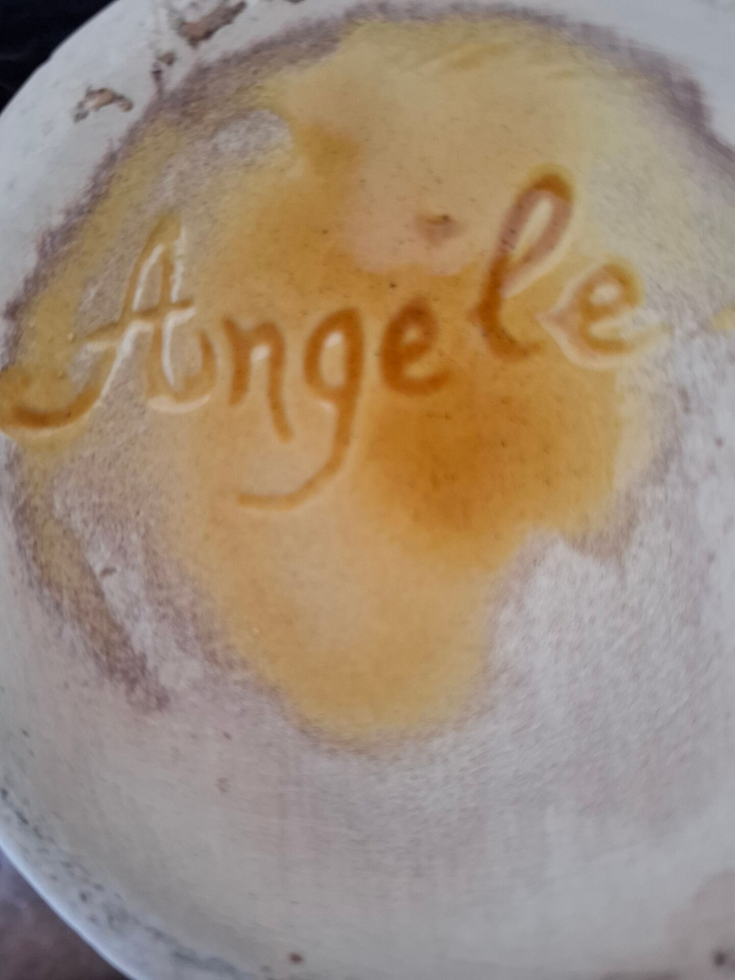 Old ceramic pitcher signed Angèle