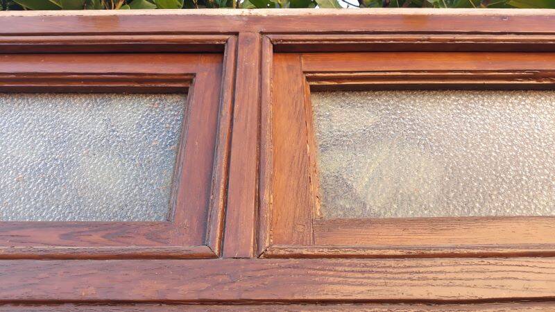 Front door and its frame, translucent glass windows, early 20th century