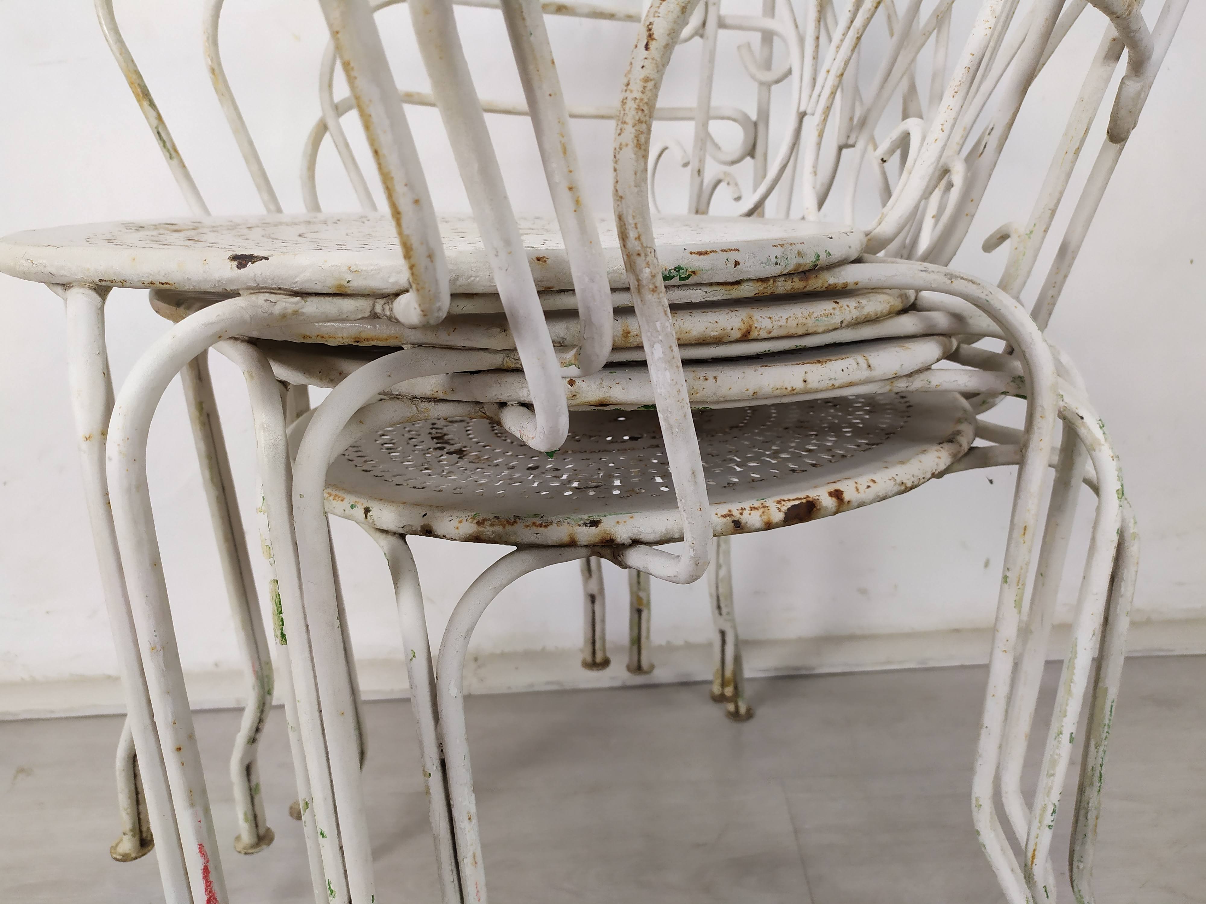 4 wrought iron garden armchairs