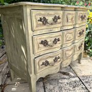 Curved antique commode in pistachio green patina.