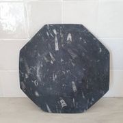 Decorative plate made of fossilised orthoceras marble.
