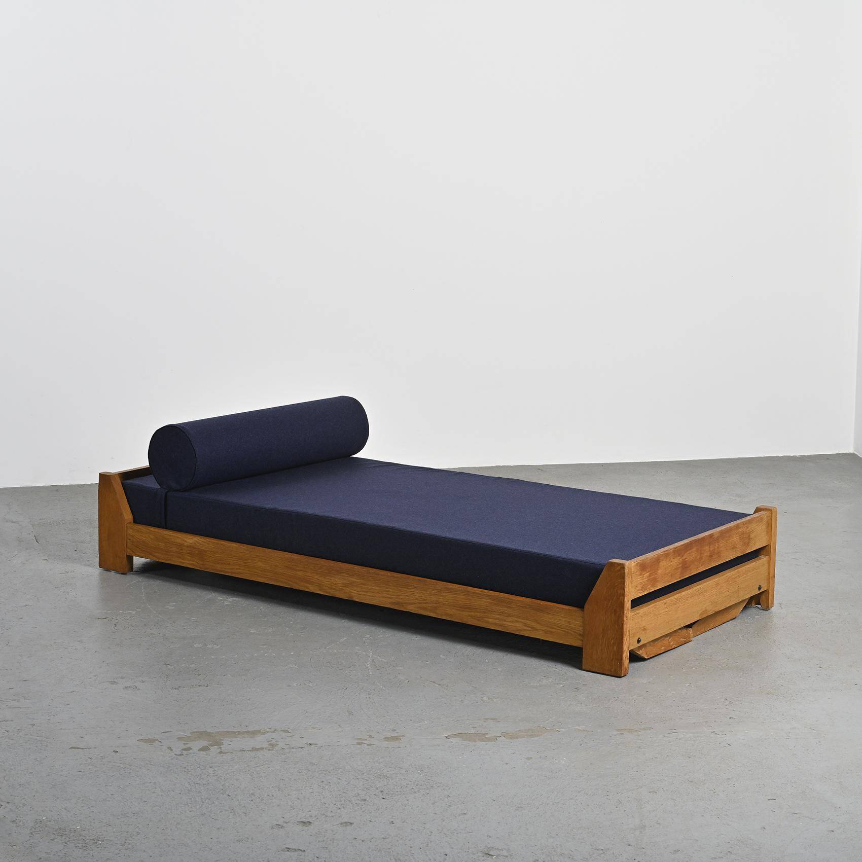 Wooden bench with midnight blue fabric, France, circa 1955