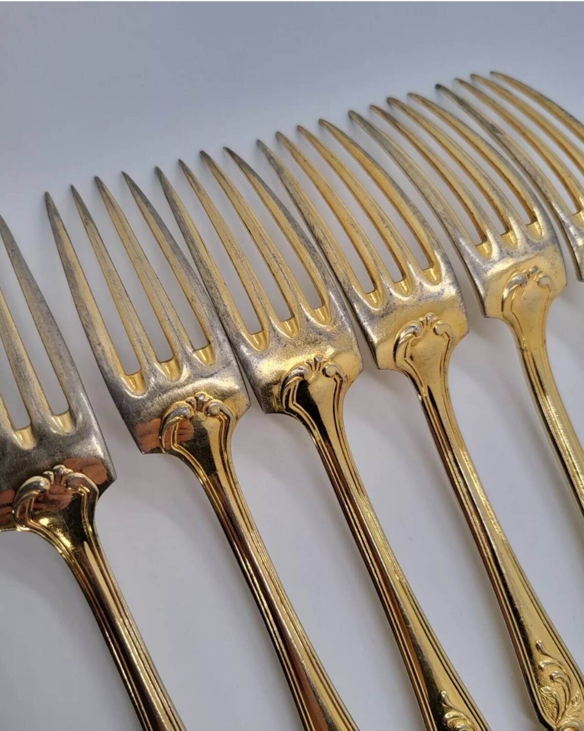 12 Table Forks in gold metal