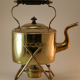 Old kettle with copper stove
